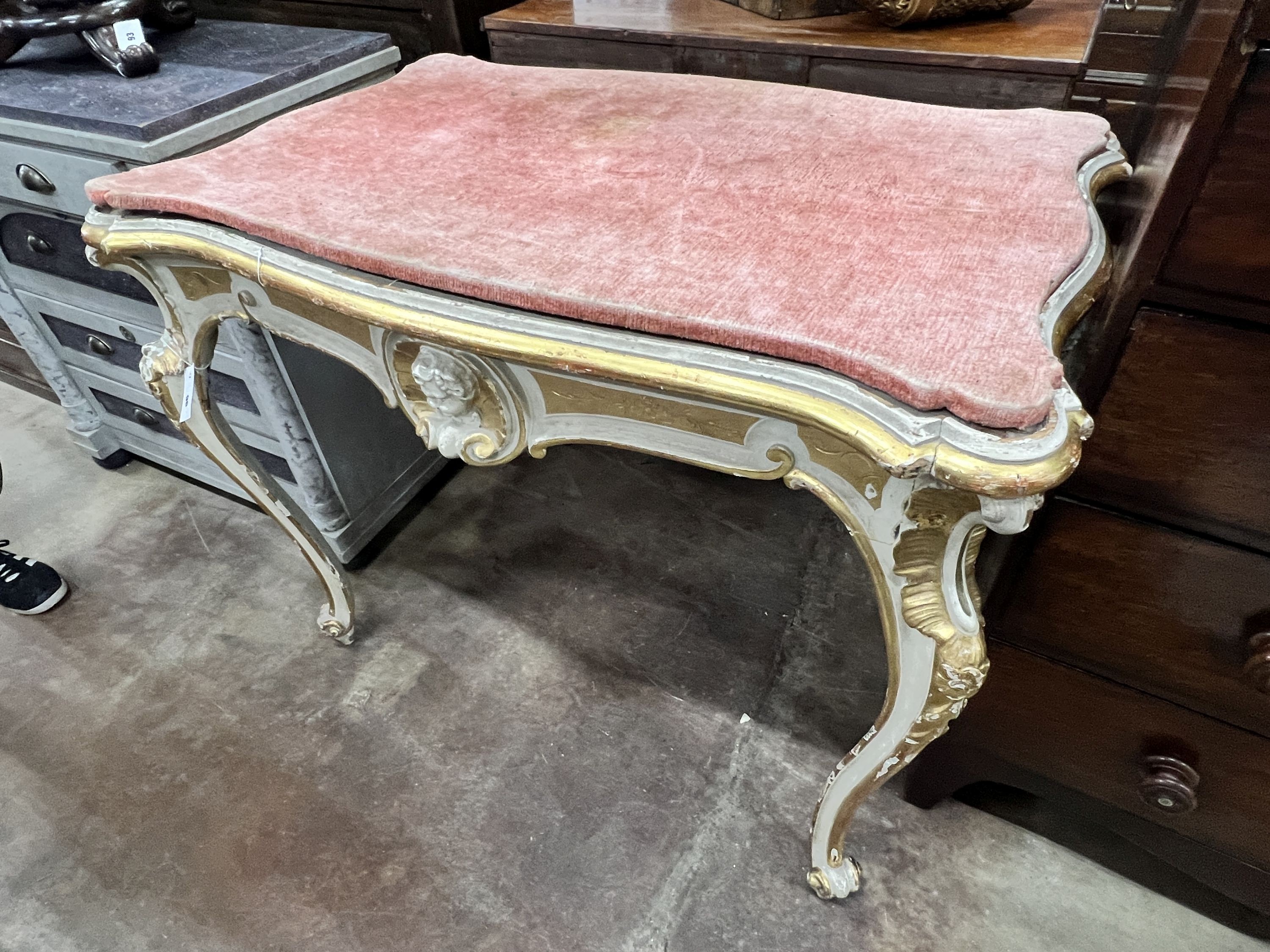 An Italian painted parcel gilt centre table, width 105cm, depth 68cm, height 86cm